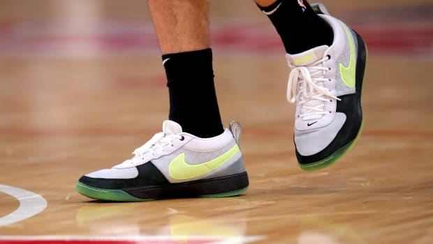 Phoenix Suns guard Devin Booker's grey and black Nike sneakers.